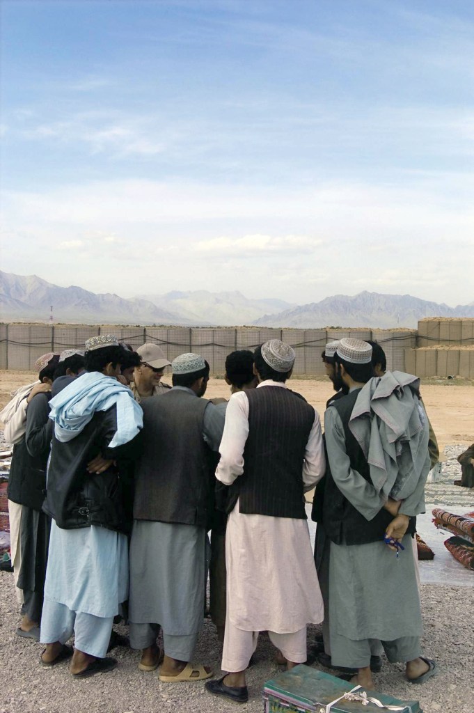 Lyndell Brown (Australian, b. 1961) and Charles Green (Australian, b. 1953) 'Afghan traders with soldiers, market, Tarin Kowt base, Uruzgan province, Afghanistan.' 2007-2008 from the exhibition 'Framing Conflict – Iraq and Afghanistan' exhibition by Lyndell Brown and Charles Green at The Ian Potter Museum of Art, The University of Melbourne, Nov 2008 - Feb 2009