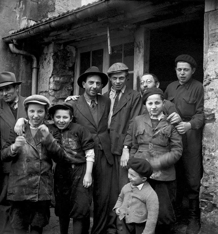 Roman Vishniac (Russian-American, 1897-1990) 'Holocaust survivors gathering outside a building where matzoh is being made' 1947