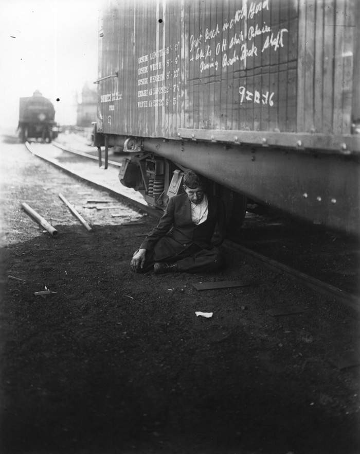 Unknown photographer. 'Man in suit underneath train' Nd Unknown photographer. 'Man in suit underneath train' Nd