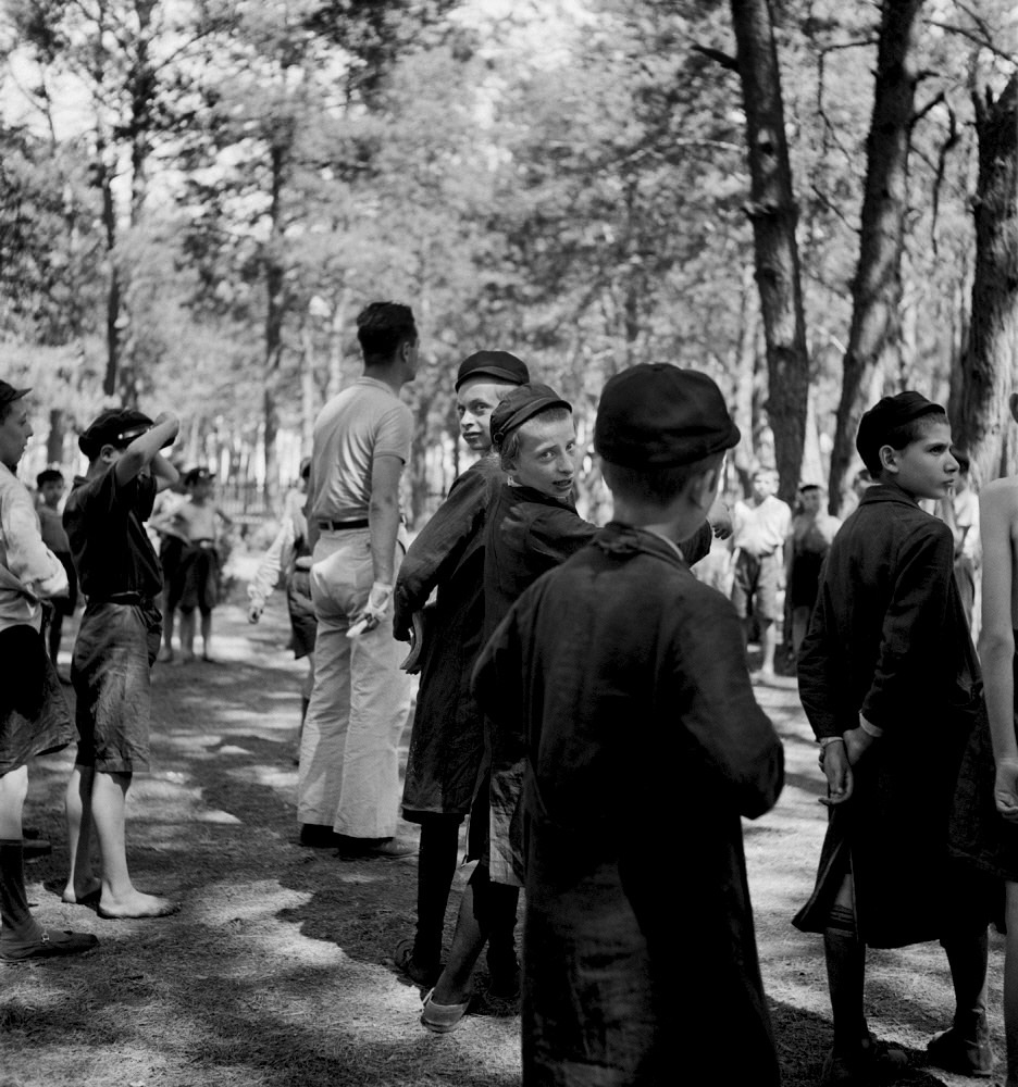 Roman Vishniac (America born Russia, 1897-1990) 'Children playing outdoors and watching a game' c. 1935-1937