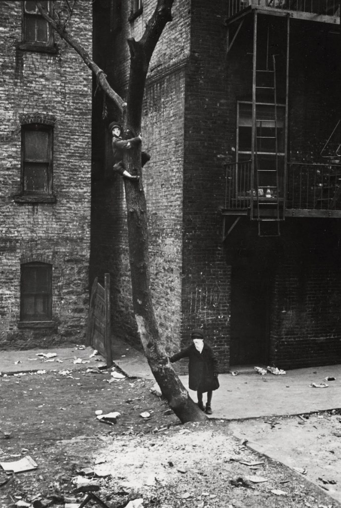 Helen Levitt (American, 1913-2009) 'Kid in Tree with Mask, New York' c. 1942
