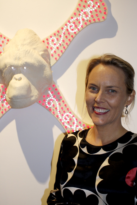 The artist Lisa Roet in front of one of her works 'Cross Bones' (2009)