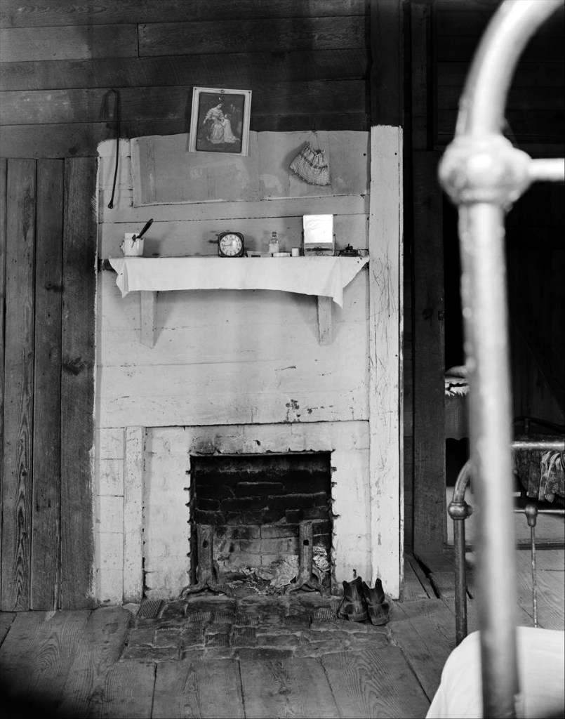 Walker Evans (American, 1903-1975) '[Fireplace in Floyd Burrroughs's Bedroom with Bedpost in Foreground, Hale County, Alabama]' 1936