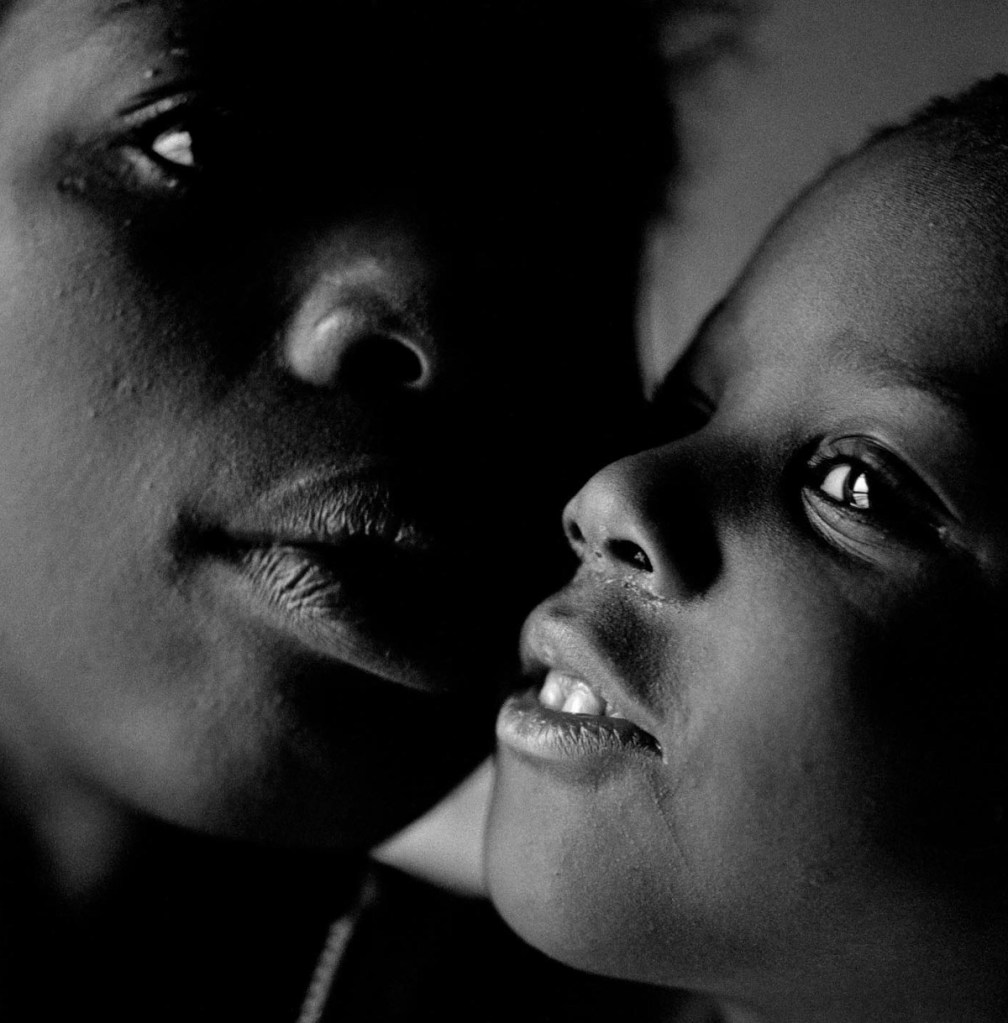Eli Reed (American, b. 1946) 'A Mother and Her Son at Her Home In Bed Sty in Brooklyn' c. 1990