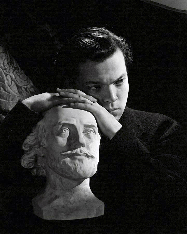 Cecil Beaton (British, (1904-1980) 'Orson Welles resting on a sculpture' 1942
