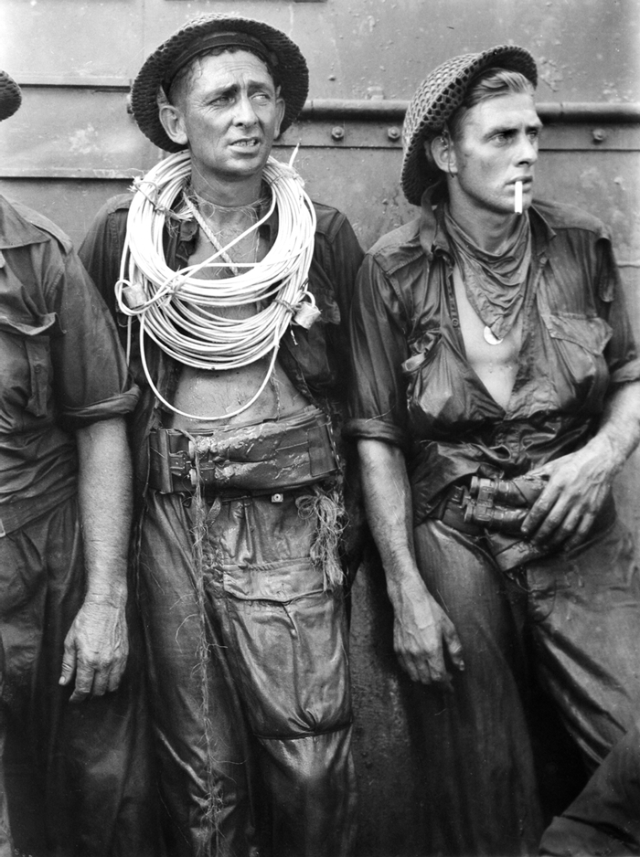 Norman Bradford Stuckey (Australian, 1914-1983) 'Engineers exhausted after destroying obstacles, Tarakan' 1945