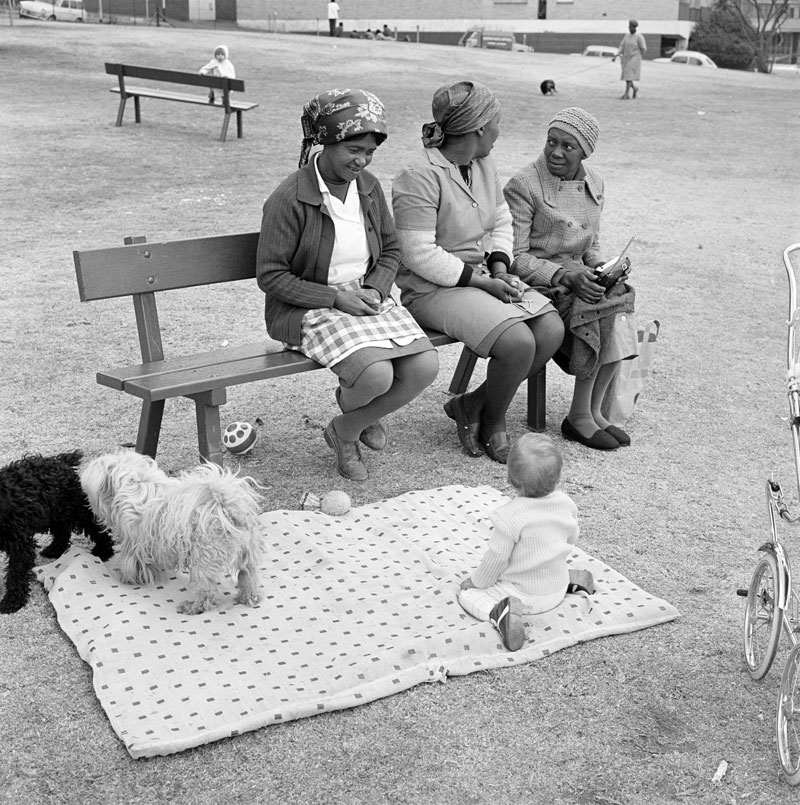 David Goldblatt. 'Baby with childminders and dogs in the Alexandra Street Park, Hillbrow, Johannesburg, 1972'