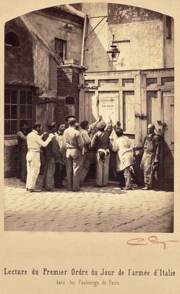 Camille Silvy (French, 1834-1910)
'Lecture du Premier Ordre du Jour de l'armée d'Italie dans Les Faubourgs de Paris' (Reading of the First Agenda of the army of Italy in the suburbs of Paris) 1859 from the exhibition 'Camille Silvy, Photographer of Modern Life, 1834-1910' at the National Portrait Gallery, London, July - Oct 2010