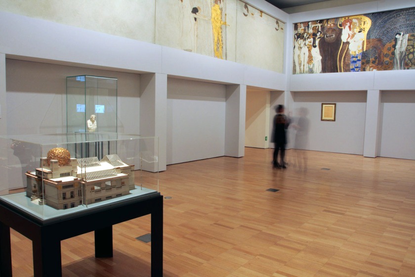 Installation view of room three of the exhibition 'Vienna - Art & Design' at the National Gallery of Victoria showing part of Gustave Klimt's 'Beethoven Frieze: Central wall' 1901-02 (detail at top)