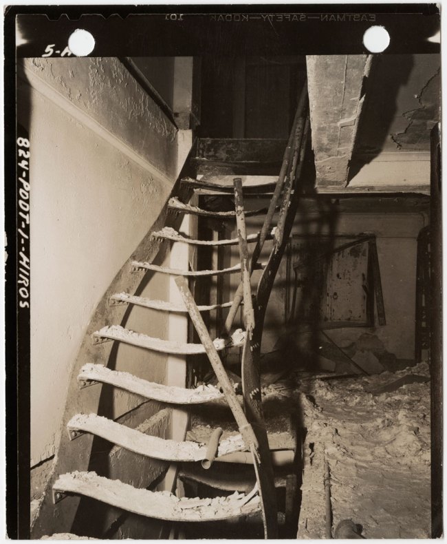 United States Strategic Bombing Survey, Physical Damage Division. '[Steel stairs warped by intense heat from burned book stacks of Asano Library, Hiroshima]' November 15, 1945