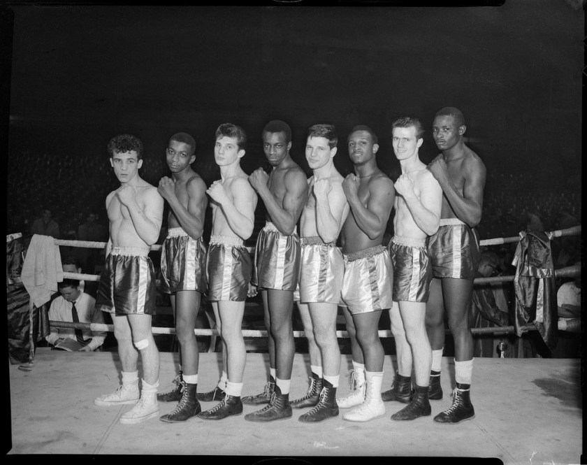 Group portrait of eight male boxers possibly Golden Gloves ...