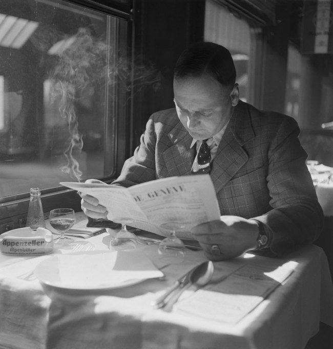 Anonymous photographer. 'Passenger in the dining car of the “Compagnie Suisse des Wagons-Restaurants”' c. 1940
