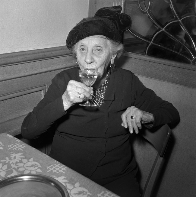 Anonymous photographer. 'Elderly lady in a restaurant, Lausanne' 1959