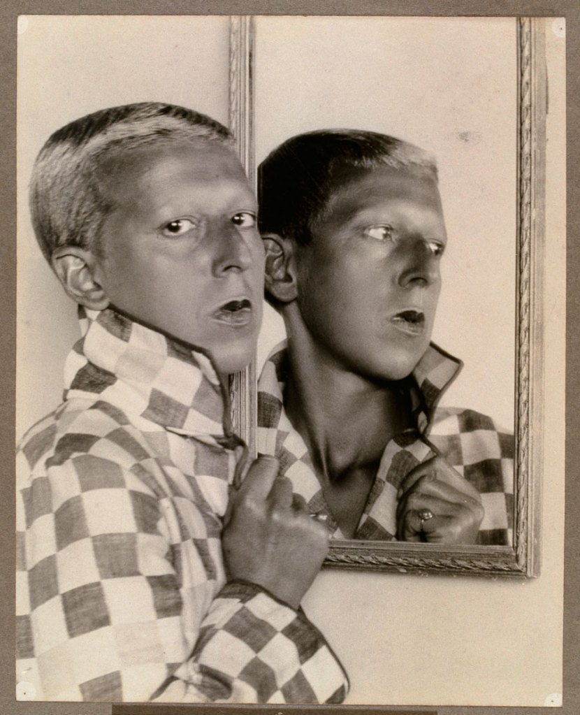 Claude Cahun (French, 1894-1954) 'Self-portrait (reflected image in mirror with chequered jacket)' 1927