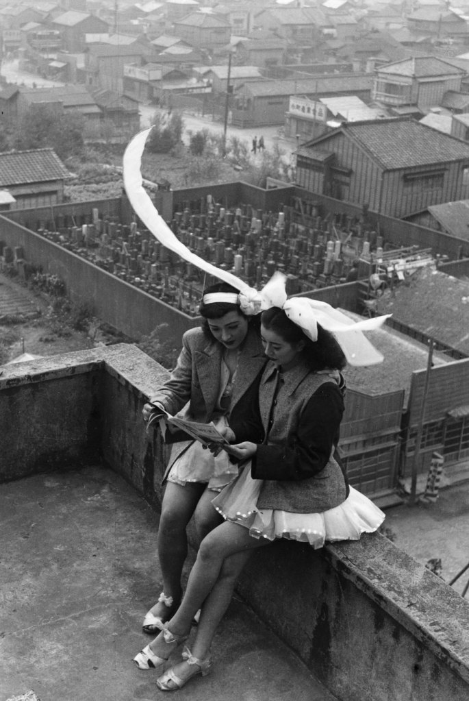 Takeyoshi Tanuma (Japanese, 1929-2022) 'Dancers resting on the rooftop of the SKD Theatre' Asakusa, Tokyo 1949