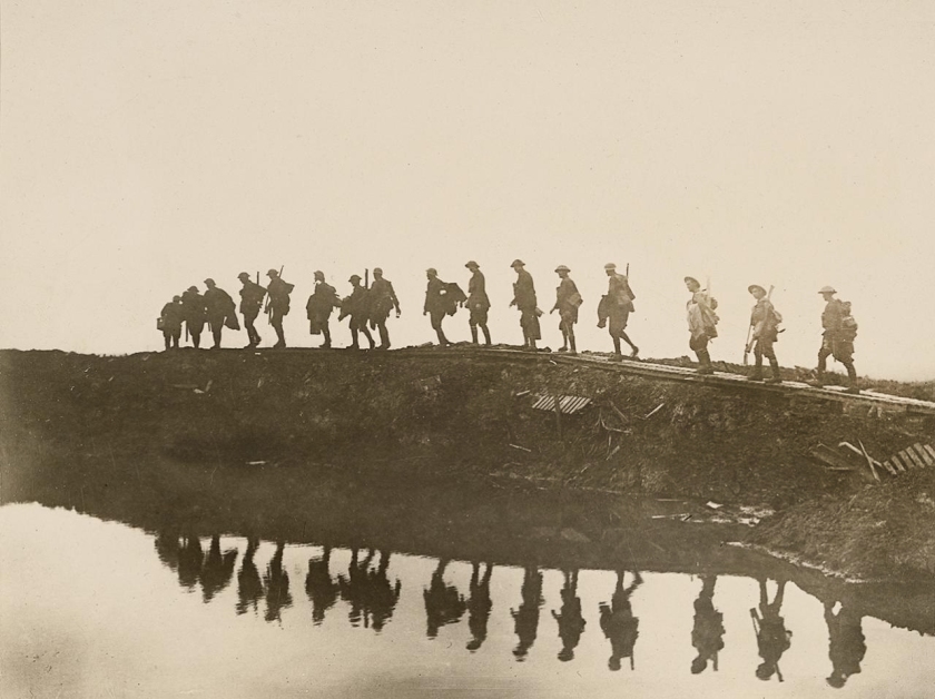 Frank Hurley (Australian, 1885-1962) 'Supporting troops of the 1st Australian Division walking on a duckboard track' 1917