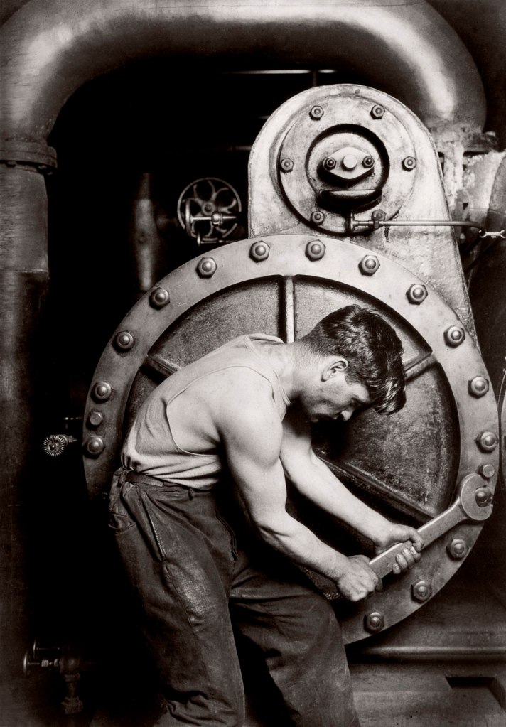 Lewis Hine. 'Powerhouse mechanic working on steam pump' 1920
