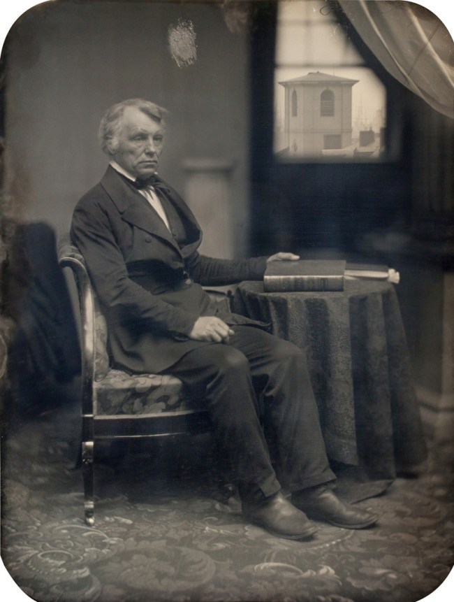 Albert Sands Southworth (American, 1811-1894) and Josiah Johnson Hawes (American, 1808-1901) 'Seated man with Brattle Street Church seen through window' 1850s