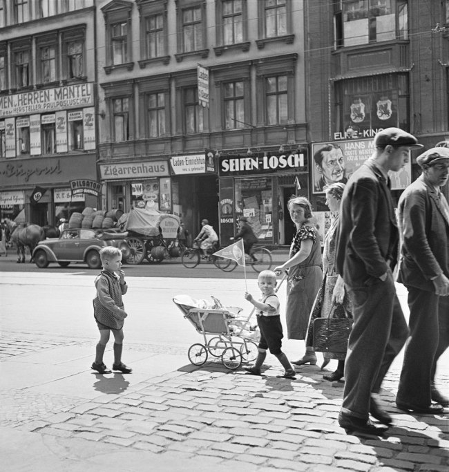 Roman Vishniac (Russian-American, 1897-1990) 'Untitled [Street scene with swastika flag in background, Berlin]' c. 1935-36