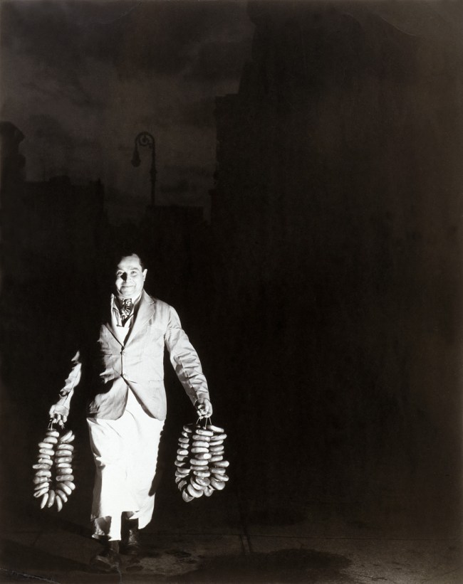 Weegee (Arthur Fellig) (American born Ukraine, 1899-1968) 'Max Is Rushing in the Bagels to a Restaurant on Second Avenue for the Morning Trade' c. 1940