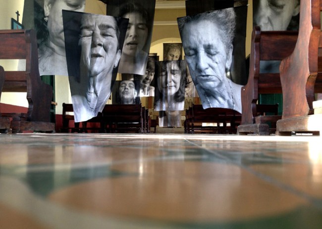 Installation photograph of Erika Diettes 'Sudarios' (Shrouds) at Iglesia de Chinquinquirá (La Chinca). Santa Fe de Antioquia [COL] December 5-9, 2012
