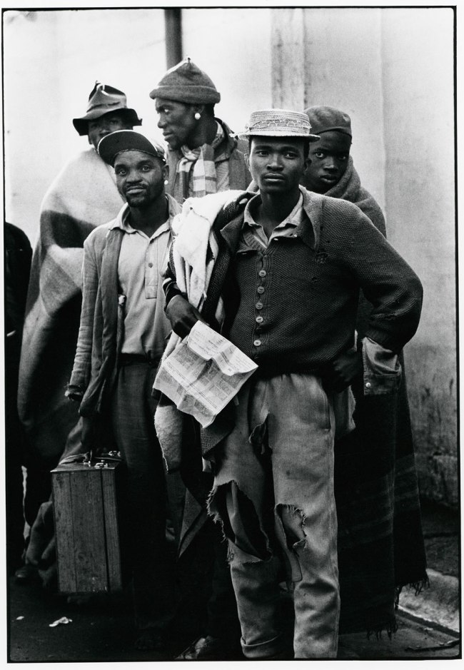 Ernest Cole (South African, 1940-1990) 'Pensive tribesmen, newly recruited to mine labour, awaiting processing and assignment' 1960-1966