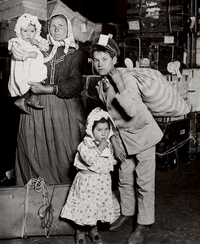 Lewis Hine (American, 1874-1940) 'Italian family looking for lost baggage, Ellis Island' 1905 Lewis Hine (American, 1874-1940) 'Italian family looking for lost baggage, Ellis Island' 1905