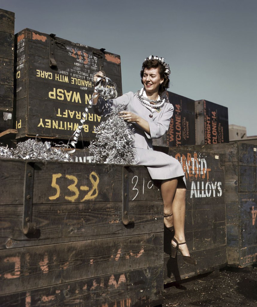 Alfred Palmer (American, 1906-1993) 'Annette del Sur publicizing salvage campaign in yard of Douglas Aircraft Company. Long Beach, California' October 1942