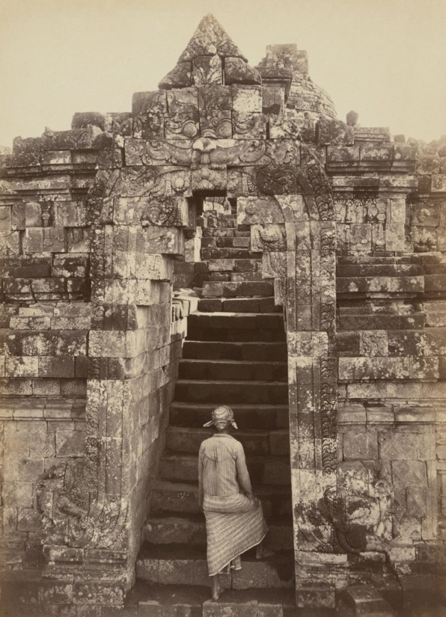 Kassian Céphas (Javanese, 1845-1912) 'Man climbing the front entrance to Borobudur' Central Java 1872