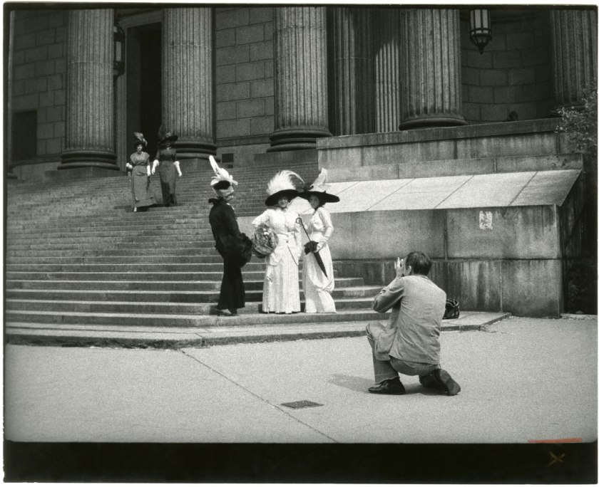 Unknown artist. 'Bill Cunningham Photographing Three Models at New York County Court House' c. 1968-1976