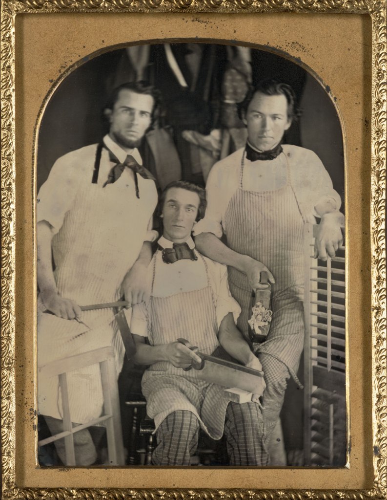 Unknown photographer. 'Three carpenters in their workshop' c. 1848-1850