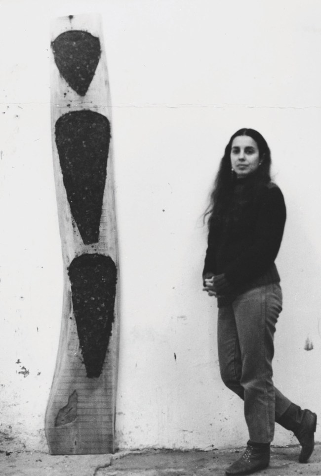 Ana Mendieta with 'Untitled' wood sculpture, 1984-1985