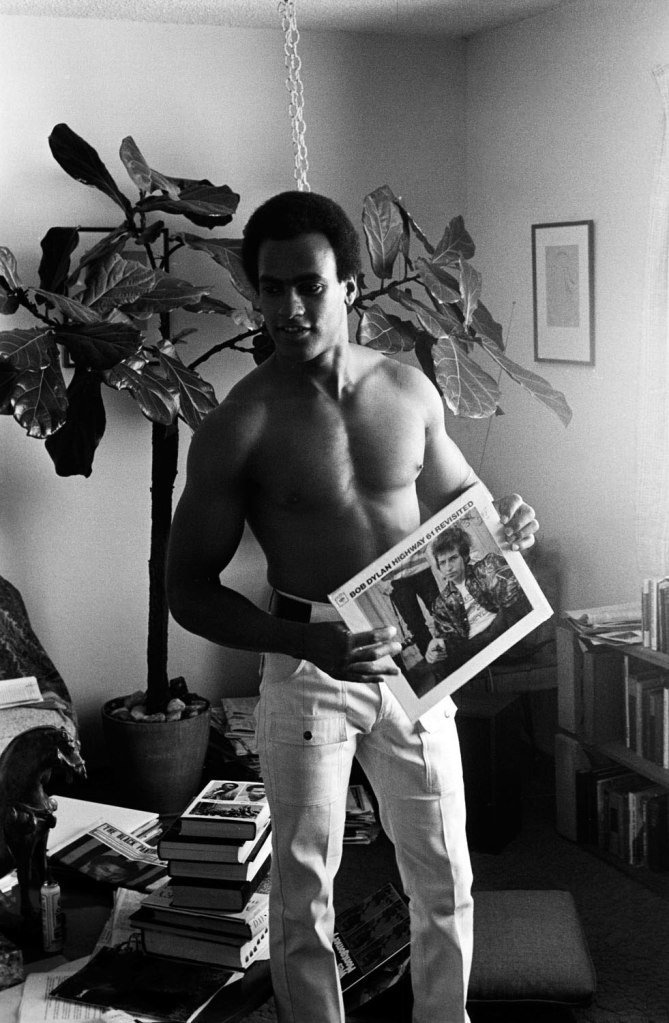 Stephen Shames (American, b. 1947) 'Huey P Newton holds a Bob Dylan album at home after he was released from jail' c. 1967