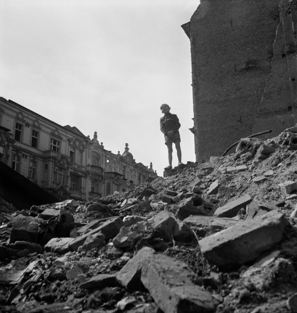 Roman Vishniac (Russian-American, 1897-1990) '[Boy standing on a mountain of rubble, Berlin]' 1947