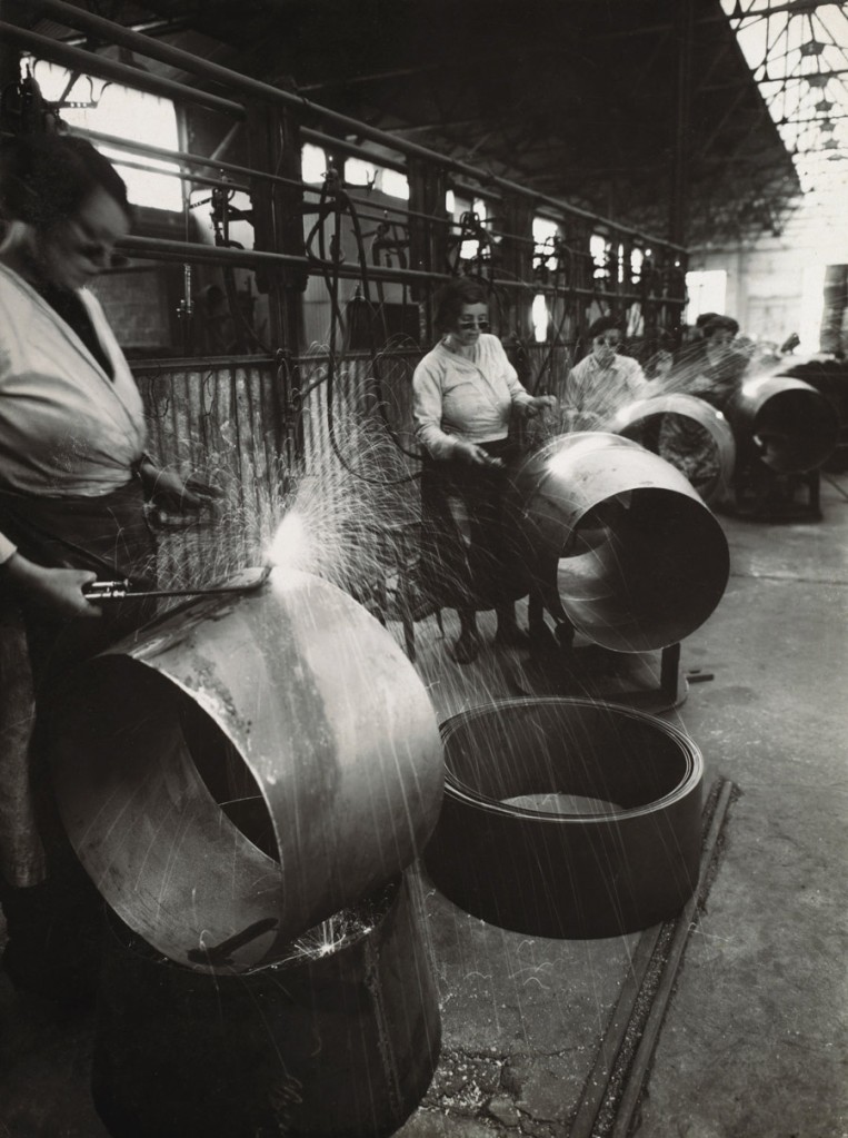 Éditions Paul Martial, Paris. 'Welding women in factory hall' c. 1940-1945