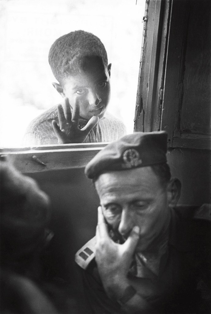 Jean Mohr (Swiss, 1925-2018) 'A few days after the Six-Day War, an Israeli officer considers an ICRC proposal, under the gaze of a Palestinian boy, Kalandia village between Jerusalem and Ramallah, 1967' Jean Mohr (Swiss, 1925-2018) 'A few days after the Six-Day War, an Israeli officer considers an ICRC proposal, under the gaze of a Palestinian boy, Kalandia village between Jerusalem and Ramallah, 1967'