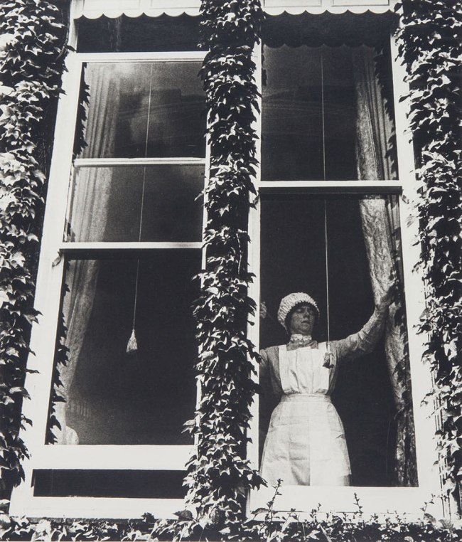 Bill Brandt (British, 1904-1983) 'Parlourmaid at the Window in Kensington' 1935