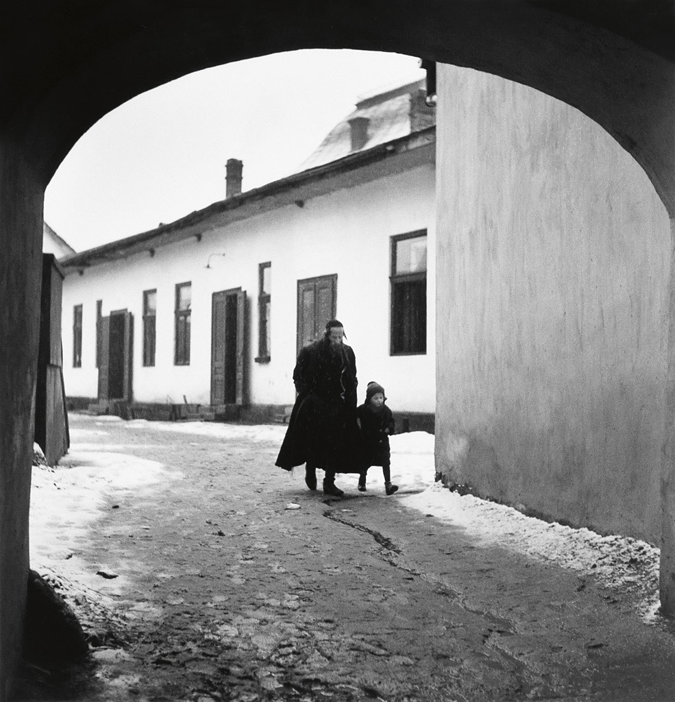 Roman Vishniac (Russian-American, 1897-1990) 'Father taking his son to the first day of cheder' 1937-1938