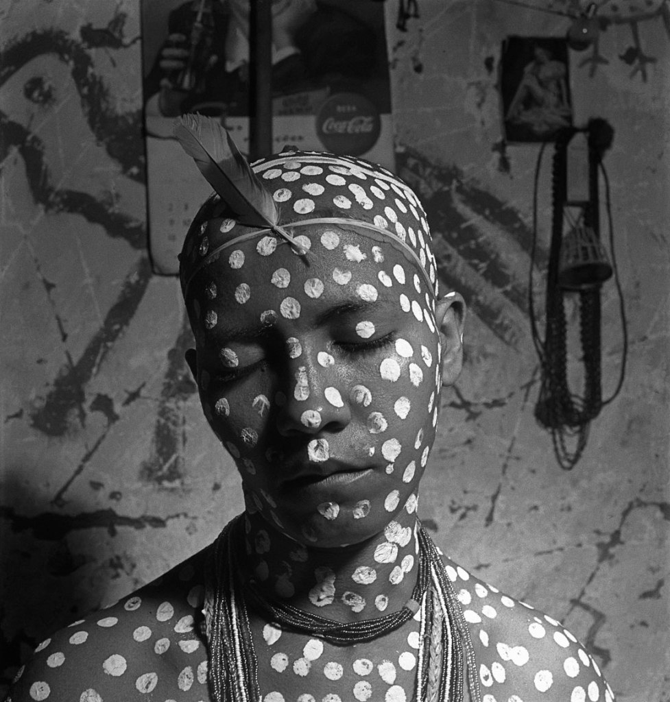 José Medeiros (Brazilian, 1921-1990) 'Novice painted with white dots that allude to Oxalá, the god of creation, and with red feathers (ekodidé), the initiation ritual, Salvador' 1951