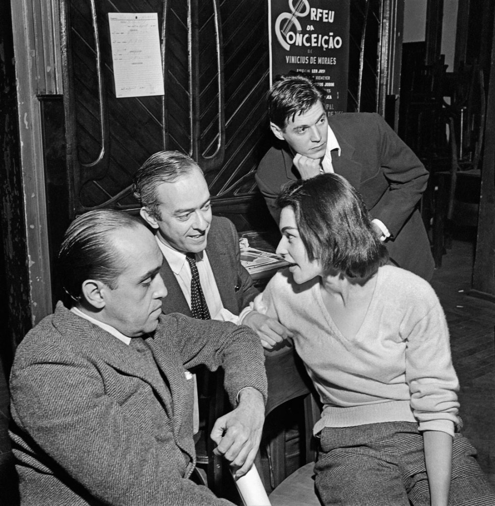 José Medeiros (Brazilian, 1921-1990) 'Oscar Niemeyer, Vinicius de Moraes, his wife Lila and Tom Jobim Bôscoli (background), behind the scenes of the first performance of Orfeu da Conceição, Rio de Janeiro' 1956