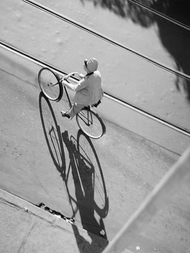 José Medeiros (Brazilian, 1921-1990) 'Woman on a bicycle crossing the railroad tracks, Rio de Janeiro' 1942