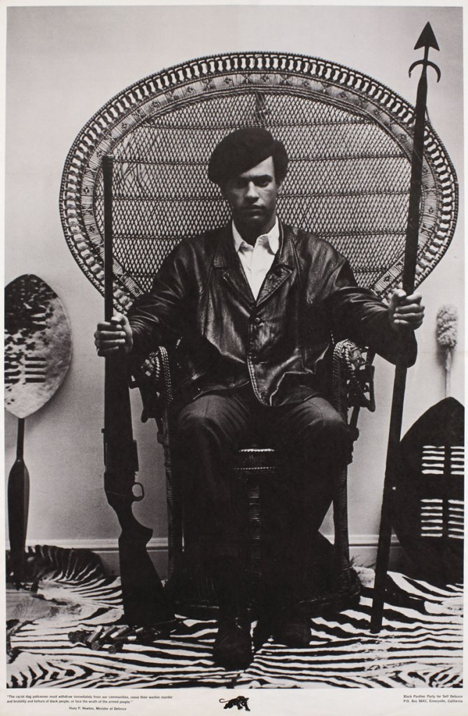 Photography attributed to Blair Stapp. Composition by Eldridge Cleaver. 'Huey Newton seated in wicker chair' 1967