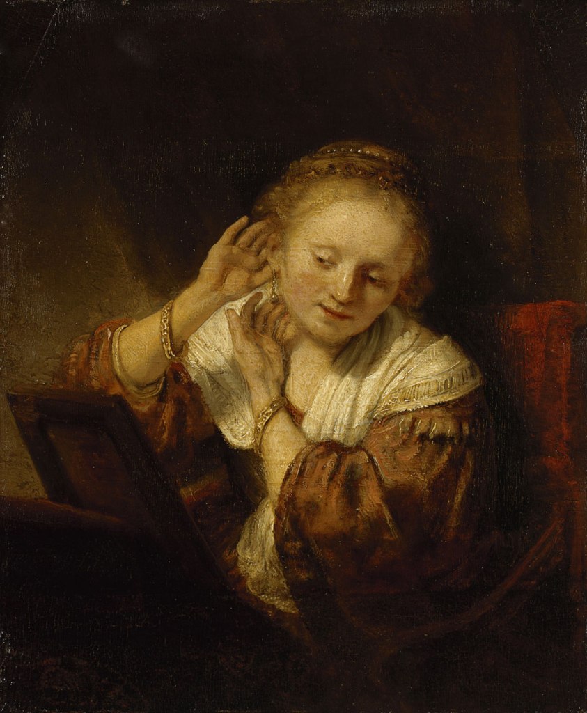 Rembrandt Harmensz. van Rijn (Dutch, 1606-69) 'Young woman trying on earrings' 1657