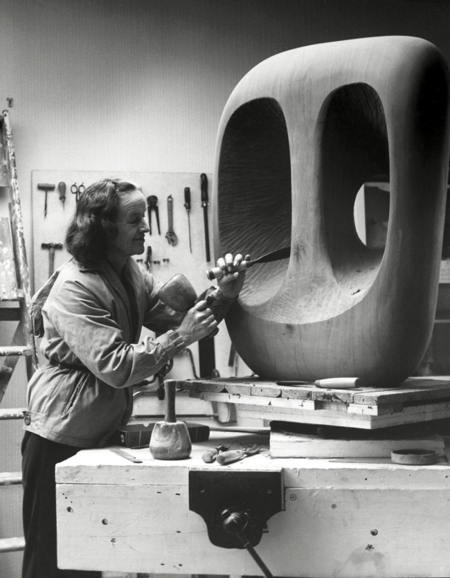 Val Wilmer (British, b. 1941) 'Barbara Hepworth in the Palais de la Danse studio, St Ives, at work on the wood carving Hollow Form with White Interior' 1963