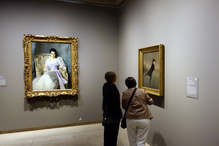 Installation view of the exhibition 'The Greats: Masterpieces from the National Galleries of Scotland' at the Art Gallery of New South Wales, Sydney with at left, John Singer Sargent's 'Lady Agnew of Lochnaw' (1892) and at right, Sir Henry Raeburn's 'Reverend Robert Walker skating on Duddingston Loch' (c. 1795)