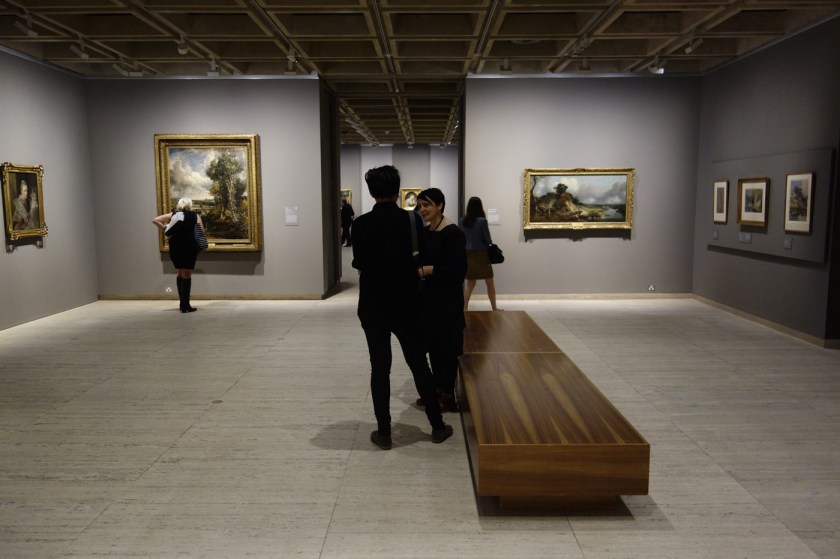 Installation view of the exhibition 'The Greats: Masterpieces from the National Galleries of Scotland' at the Art Gallery of New South Wales, Sydney showing at left, John Constable's 'The Vale of Dedham' (c. 1827-1728) and at right, Thomas Gainsborough's 'River landscape with a view of a distant village' (c. 1748-1750)