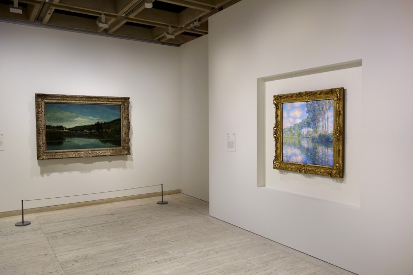 Installation view of the exhibition 'The Greats: Masterpieces from the National Galleries of Scotland' at the Art Gallery of New South Wales, Sydney showing at left, Camille Pissarro's 'The Marne at Chennevières' (c. 1864-1865) and at right, Claude Monet's 'Poplars on the Epte' (1891)