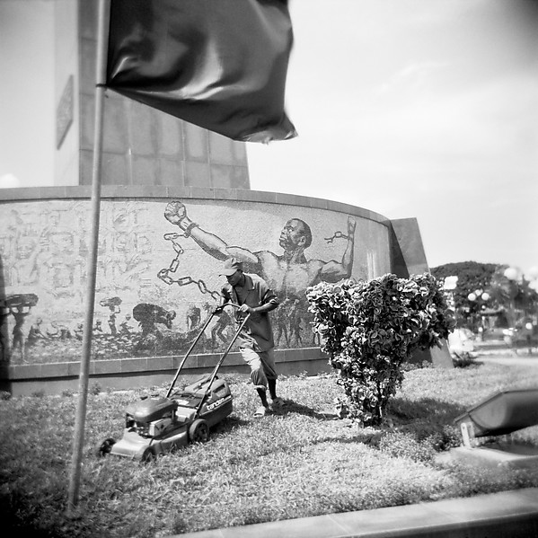 Jo Ractliffe (South African, b. 1961) 'Man maintaining the lawn of the Monumento de Agostinho Neto' 2007