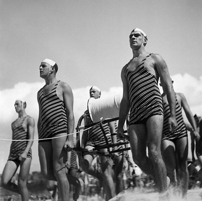 George Caddy (Australian, 1914-1983) 'Freshwater Surf Life Saving Club reel team march past, 3 April 1938' 1938
