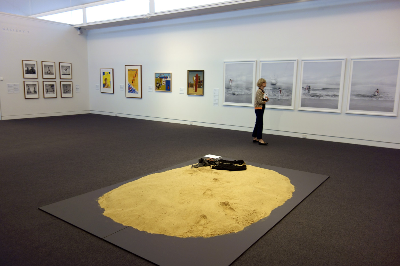 Installation view of the exhibition 'On the beach' at the Mornington Peninsula Regional Art Gallery with in the foreground, Leanne Tobin's 'Clothes don't always maketh the man' (2012), and in the background right, photographs from Michael Cook's 'Undiscovered' series (2010) Installation view of the exhibition 'On the beach' at the Mornington Peninsula Regional Art Gallery with in the foreground, Leanne Tobin's 'Clothes don't always maketh the man' (2012), and in the background right, photographs from Michael Cook's 'Undiscovered' series (2010)